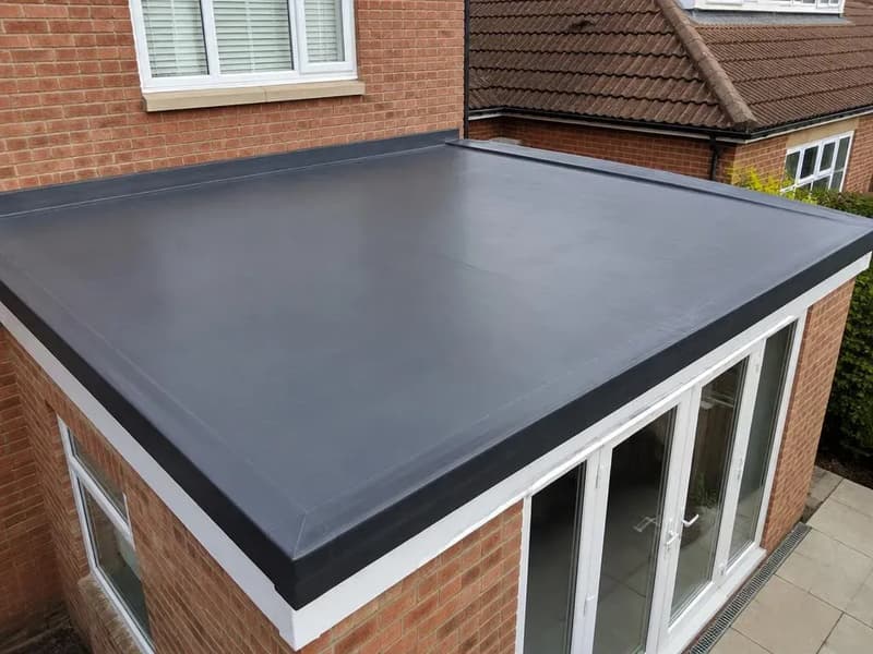 Newly installed flat rubber roof on a house extension